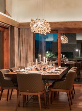 accommodation - The Calima Estate - chalet calima dining table with chandelier and seating for eight